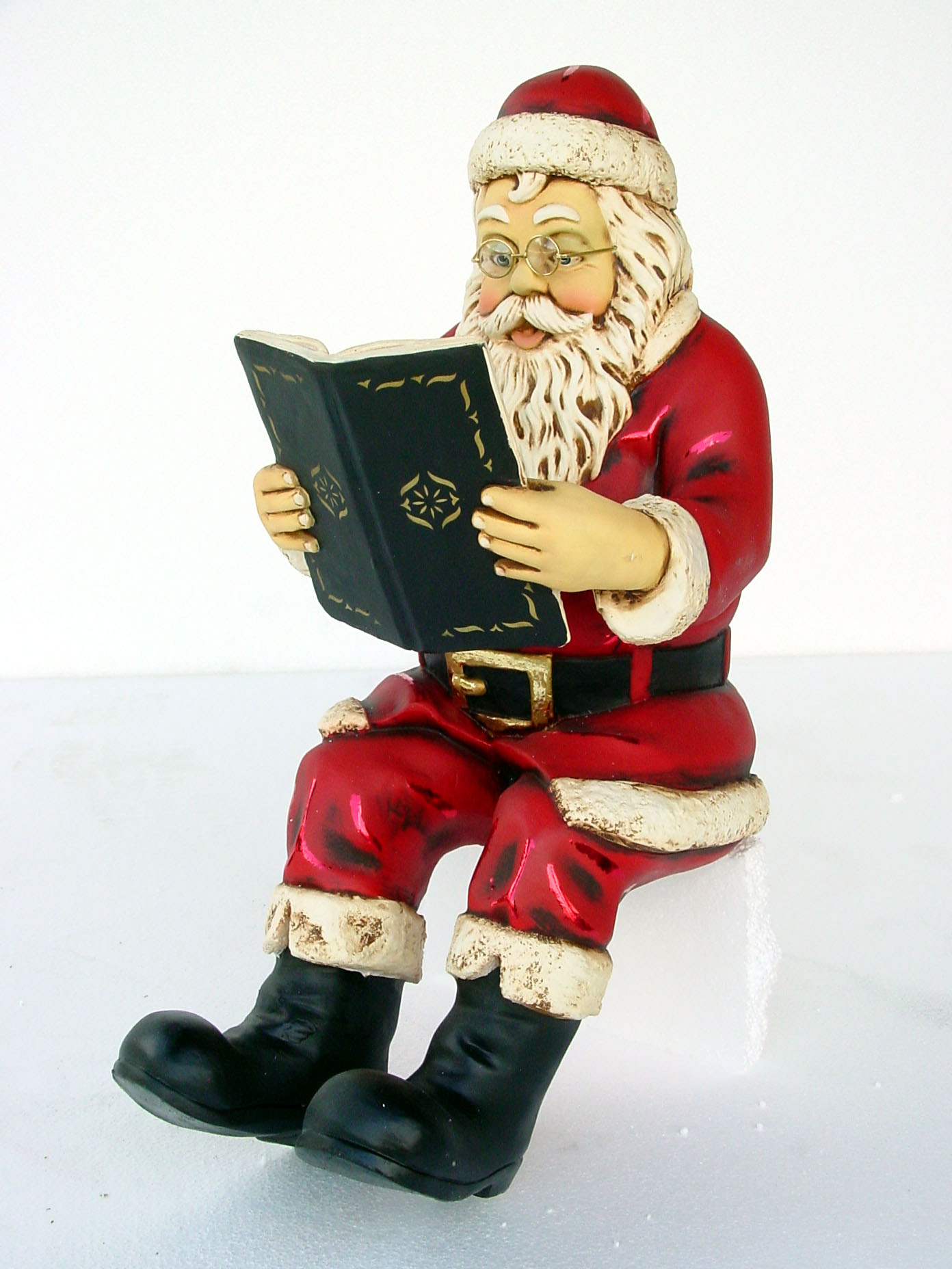 santa sitting reading book statue santa sitting reading book statue
