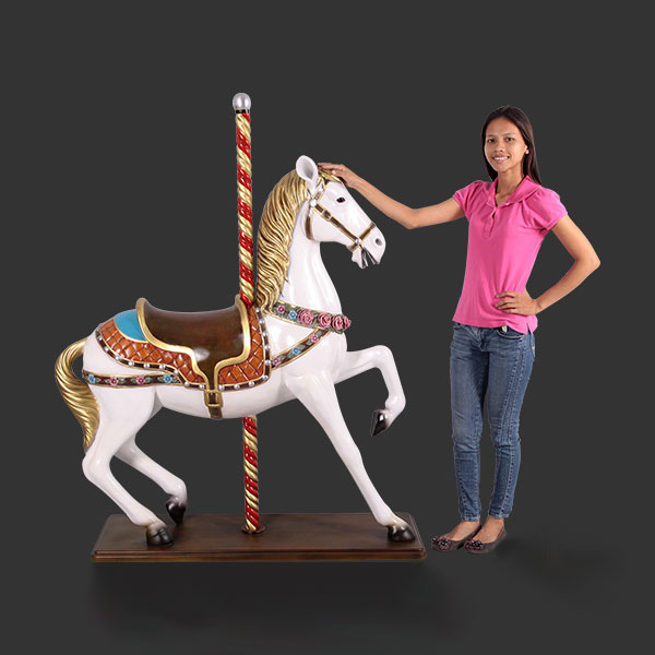 large carousel horse statue white with flowers